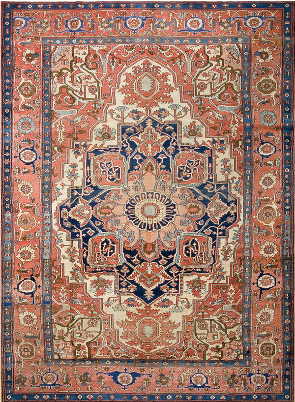 Detailed traditional rug with a large navy blue medallion centered on a salmon and ivory field.