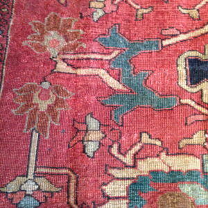 Colorful floral patterns on vintage rug
