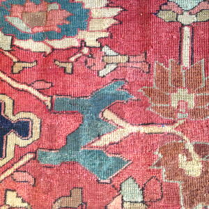 Colorful floral pattern on vintage rug