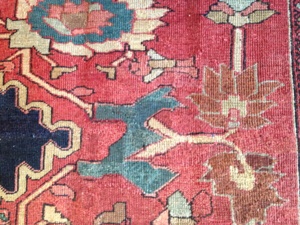 Colorful floral pattern on vintage rug