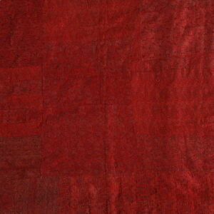 Rich red textile with intricate patterns