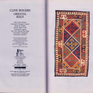 Flat textile featuring geometric medallions and borders in vibrant red, navy, yellow, and cream colors.