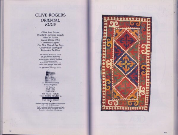 Flat textile featuring geometric medallions and borders in vibrant red, navy, yellow, and cream colors.