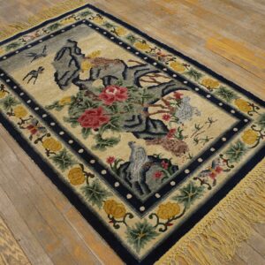 High-pile rug with a blue border, cream field, red flowers, and birds, lying on distressed wood floors.