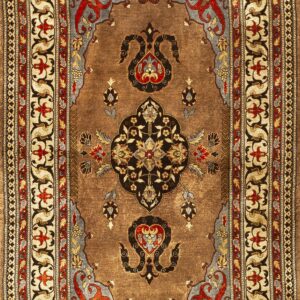 Traditional brown rug with a complex central medallion and ornate borders in red, black, and cream.