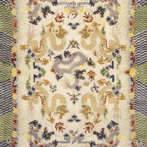 Off-white rug features golden dragon designs and borders of green and navy zigzag patterns.