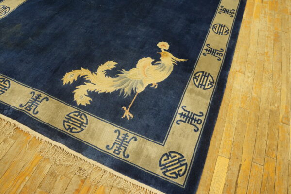 Navy rug with golden phoenix design