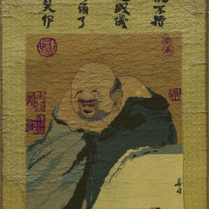 Textured gold and brown rug featuring black calligraphy and a portrait of a smiling figure in blue-green robes.