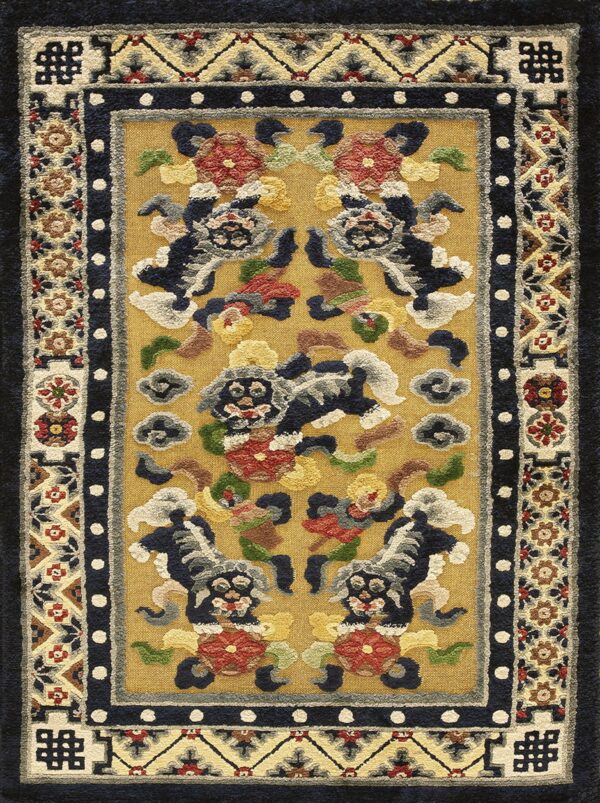 Thick-textured gold rug displaying a traditional pattern of five stylized lions within geometric borders.