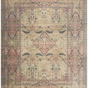 Muted traditional rug featuring a detailed symmetrical design and borders in beige, blush pink, and slate blue.