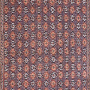 Intricate low-pile rug featuring red, dark blue, and cream geometric diamond patterns with wide zigzag borders.