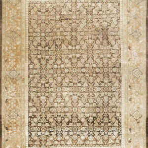 Traditional area rug featuring a dense dark brown floral pattern surrounded by a wide, patterned light beige border.