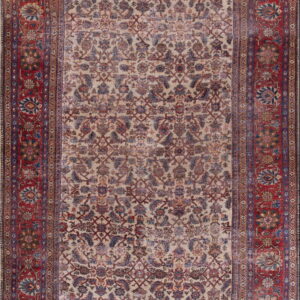Distressed runner rug with a cream field, all-over faded red and blue floral motifs, and a wide red border.