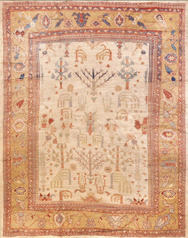 Beige rug with a tribal tree pattern and golden tan borders featuring abstract floral designs in red and blue.