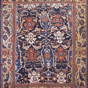 Traditional rug with a navy blue field featuring rust and blue medallions and a beige floral border.