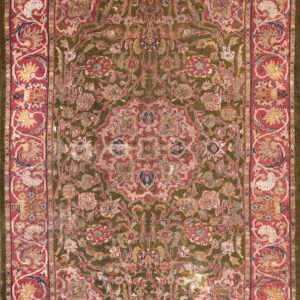 Ornate area rug featuring a central medallion on an olive green field with wide red floral borders.