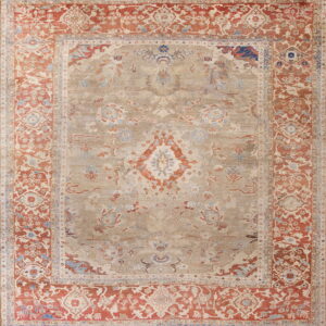 Muted traditional rug with an intricate beige field and wide red-orange ornamental borders.