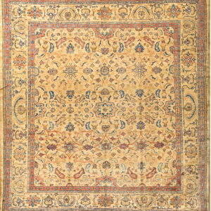 Traditional square rug with a golden beige field and ornate botanical patterns in muted blue and rust.