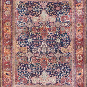 Detailed traditional rug featuring a dense floral navy blue center field and a complementary red-rust border.