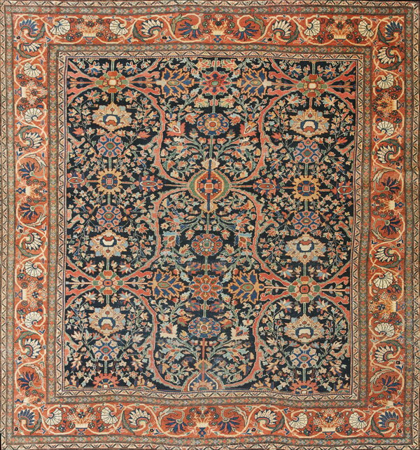 Traditional rug with a navy blue field filled with complex floral medallions and rust orange borders.