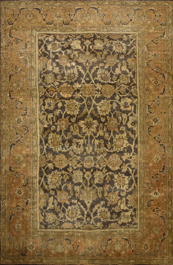Distressed rug with a dark brown floral field and an ornate rust and tan botanical border pattern.
