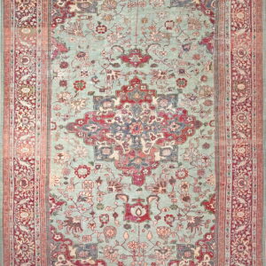 Ornate area rug with a mint green field, featuring a large red central medallion and detailed borders.