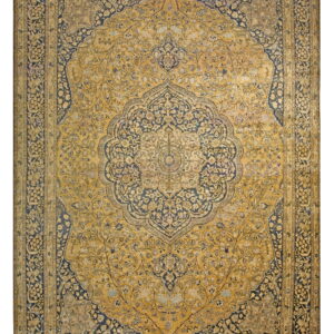 Ornate traditional rug with a central medallion in mustard yellow and deep indigo blue floral designs.
