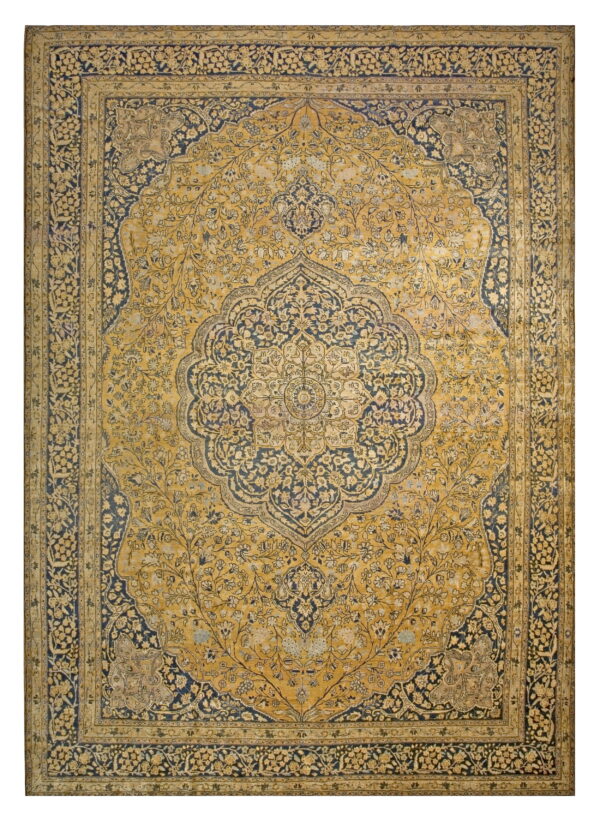 Ornate traditional rug with a central medallion in mustard yellow and deep indigo blue floral designs.