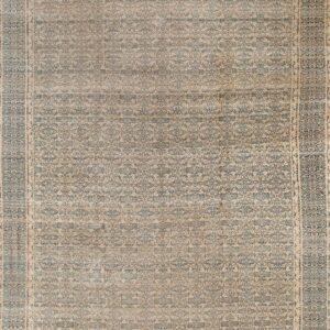 Faded intricate floral patterned rug