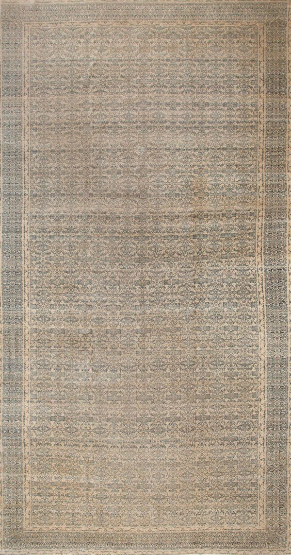 Faded intricate floral patterned rug