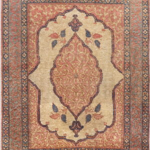 Ornate rug featuring a beige central niche medallion bordered by rust and navy floral motifs.