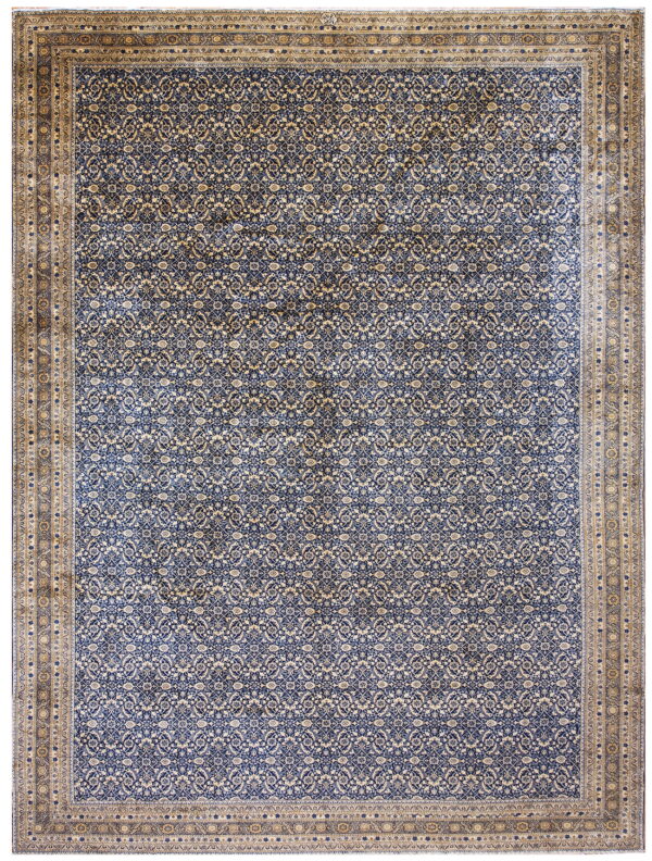 Navy blue and cream patterned rug featuring a dense repeating lattice design and a broad beige border.