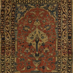 Red and tan rug with a central arched floral design, navy accents, and complex geometric borders.