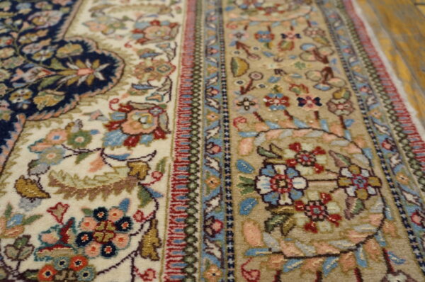 Intricate floral patterns on ivory rug