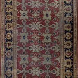 Low-pile traditional rug featuring faded red, beige, and navy interlocking floral patterns.