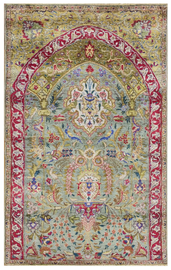 Rare green color fine luxurious silk pile antique persian tabriz islamic prayer design rug 1 A detailed low pile rug with a light aqua field, red border, and ornate floral mihrab design.