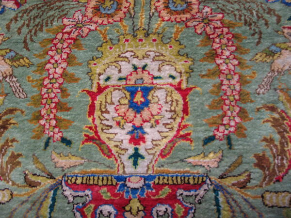 Rare green color fine luxurious silk pile antique persian tabriz islamic prayer design rug 3 Ornate rug detail showing a red, gold, and cream central design against a sage green field.