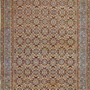 Ornate area rug featuring a cream field, repeated floral lattice, and a wide dusty blue and red border.