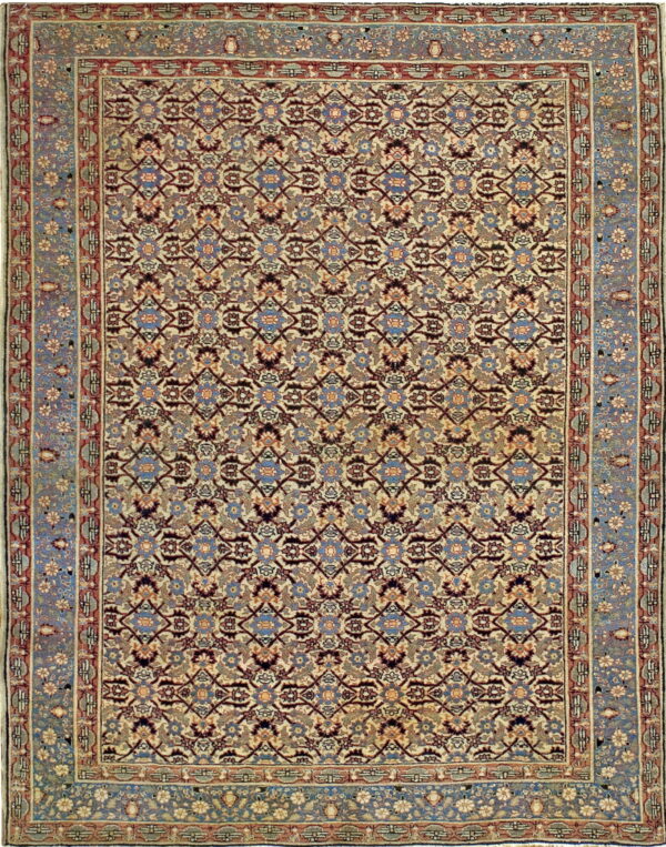 Ornate area rug featuring a cream field, repeated floral lattice, and a wide dusty blue and red border.