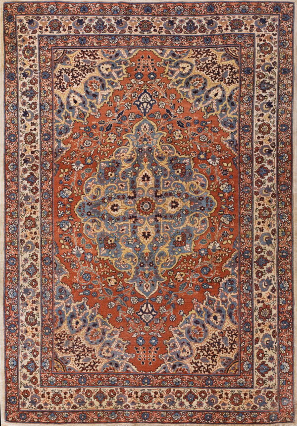 Traditional rust red low-pile rug with a blue medallion and intricate floral borders on a cream ground.