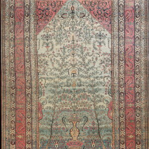 Ornate rug featuring a pale blue-green Tree of Life design beneath a decorated arch, framed by salmon borders.