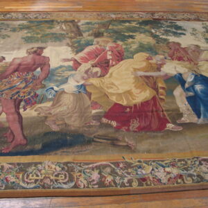 Low-pile rug depicting a scenic classical tapestry design with figures in red, gold, and blue robes on wood flooring.