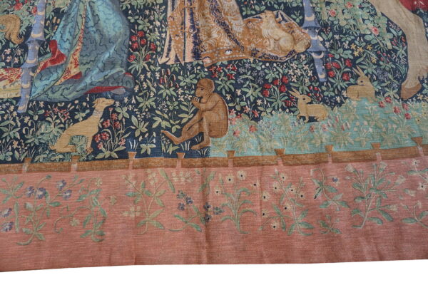 Colorful tapestry depicting animals and figures