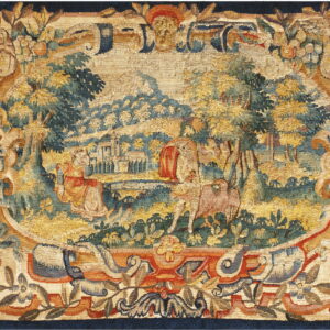 This low-pile tapestry features a gold, teal, and rust landscape vignette surrounded by an ornate floral border.