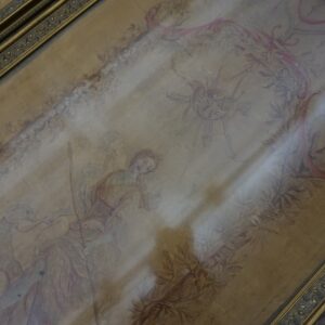 Muted tan and pink flatweave rug with a detailed allegorical pattern rests inside an antique gold frame.