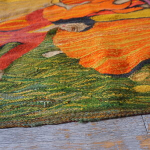 Colorful floral design on textured rug