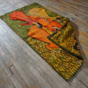 Colorful tapestry on wooden floor