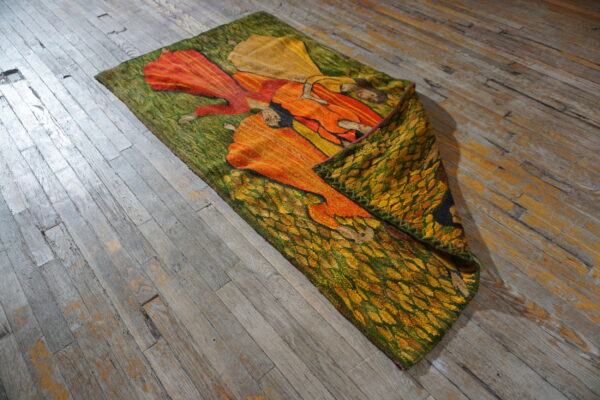 Colorful tapestry on wooden floor