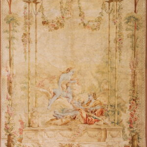 Low-pile beige rug with a detailed romantic pattern showing figures, flowers, and birds in an arbor.