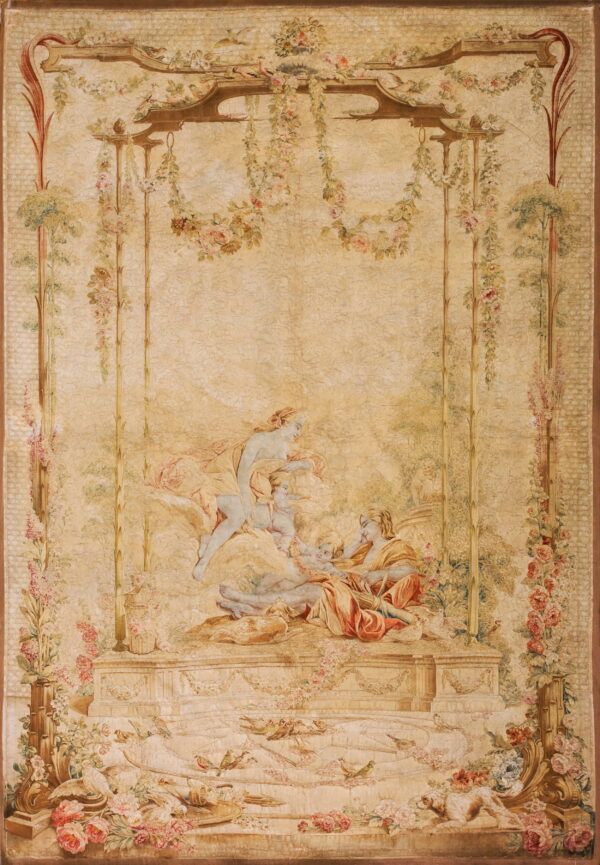Low-pile beige rug with a detailed romantic pattern showing figures, flowers, and birds in an arbor.
